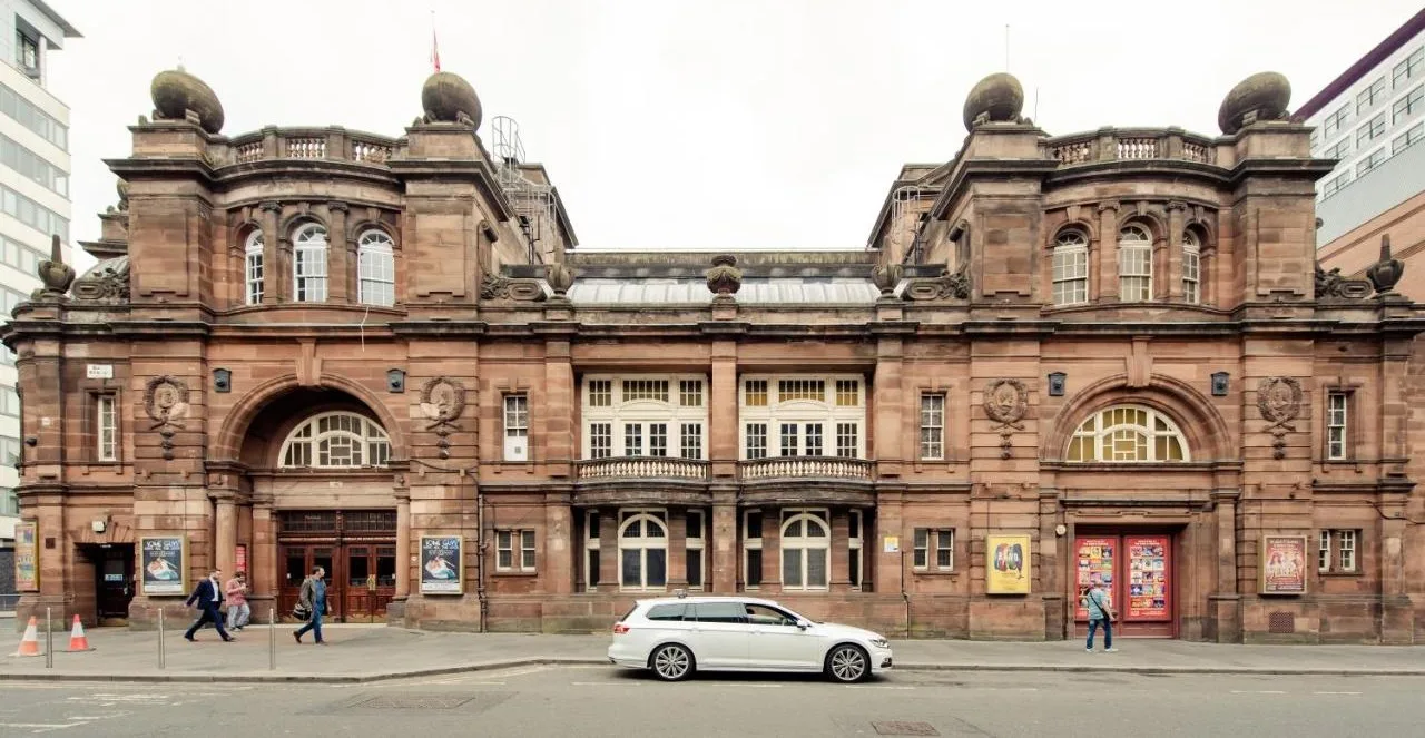 Exterior of PREMIER SUITES PLUS Glasgow Bath Street with a car parked outside