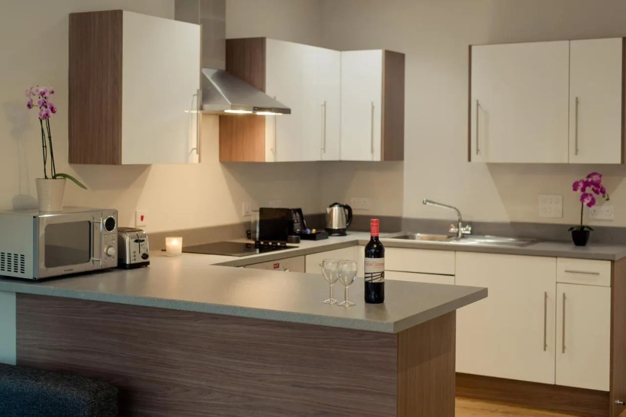 Kitchen counter with wine and glasses in a Glasgow city centre apartment